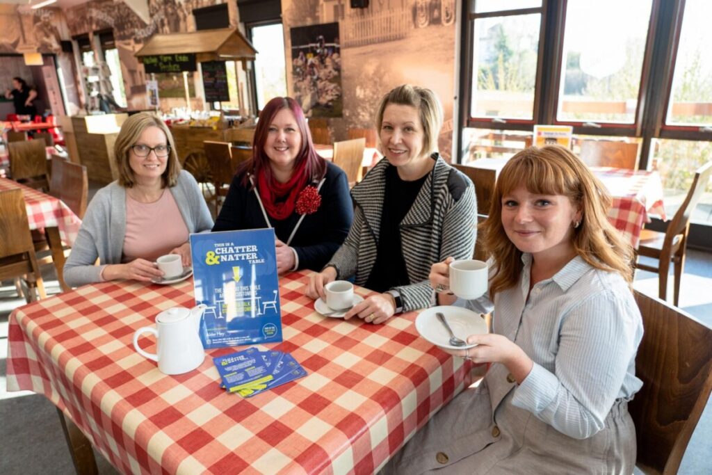 Women sitting at Chatty Cafe table